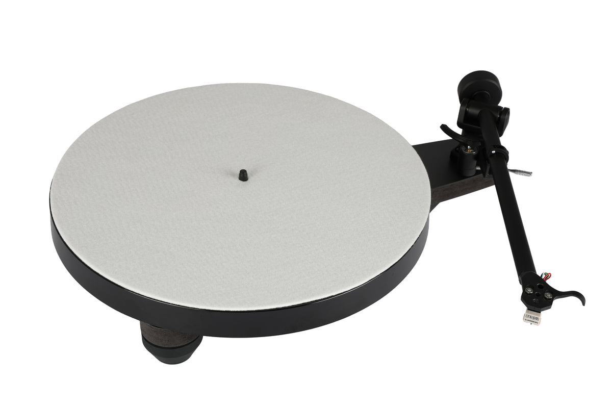 Rega Replay Plug and Play Turntable with Rega Carbon Cartridge on display, showcasing its sleek design and RB110 tonearm.