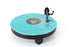 Rega Replay Plug and Play Turntable with Rega Carbon Cartridge featuring turquoise vinyl record.